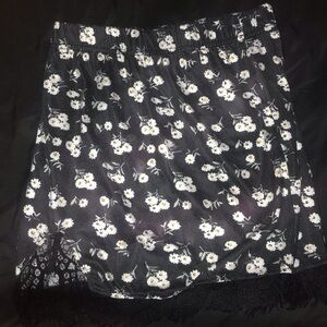 Black flower mini skirt with lace trim.